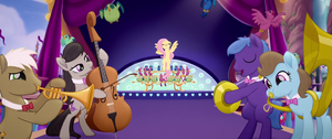 Fluttershy and orchestra on the stage MLPTM.png