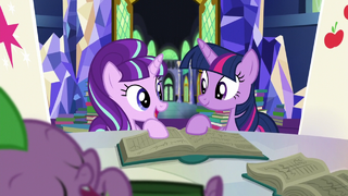 Starlight and Twilight look at each other while holding book S5E26.png