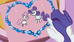 Rarity looking at Sweetie Belle's drawing S02E05.png