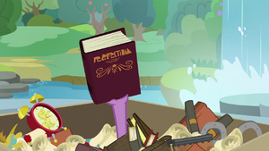 Spike holding up Twilight's book S9E5.png