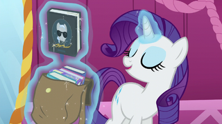 Rarity levitates one of the books from the bag S5E22.png