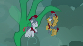 Green dragon stretches claw at white Legion cadet S7E16.png