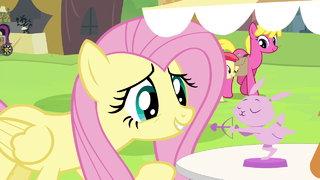 Fluttershy looking at bunny figurine S4E22.png