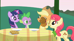 Apple Bumpkin drops candy apples on the table S1E01.png