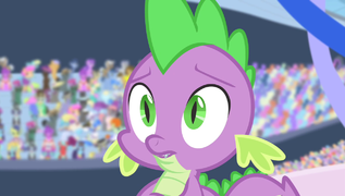 Spike surrounded by staring ponies S4E24.png